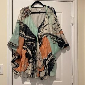 Diane von Furstenberg size 8 multicolor V-neck dress with fitted slip attached.